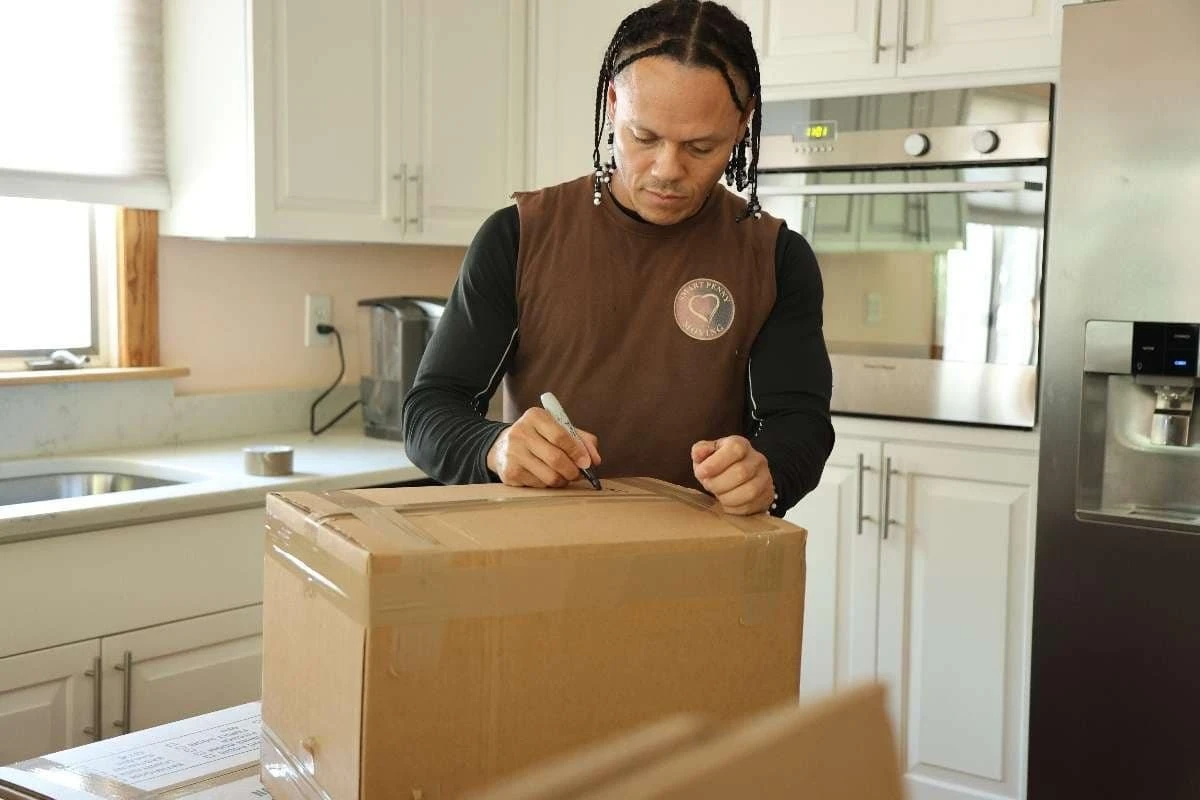 Smart Penny Moving crew packing a home